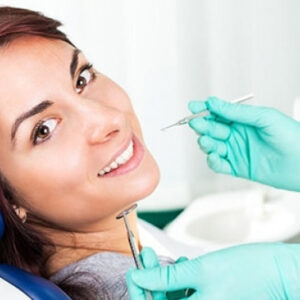 Caries treatment and filling, ultrasonic cleaning and restoration of front teeth